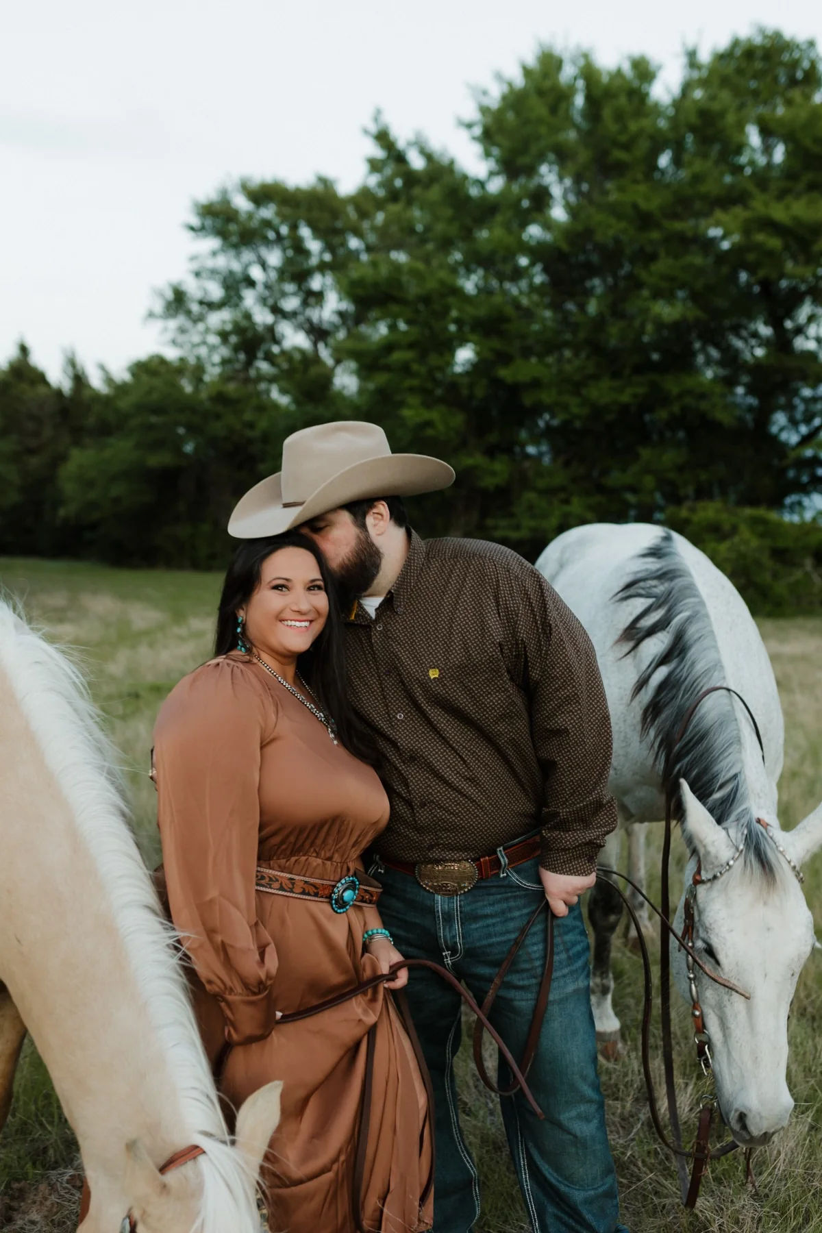 The Johnsons standing with horses