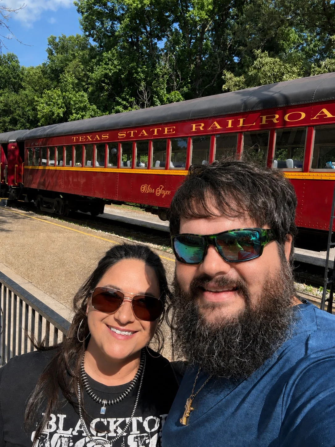 The Johnsons at the Texas State Railroad with a necklace being worn
